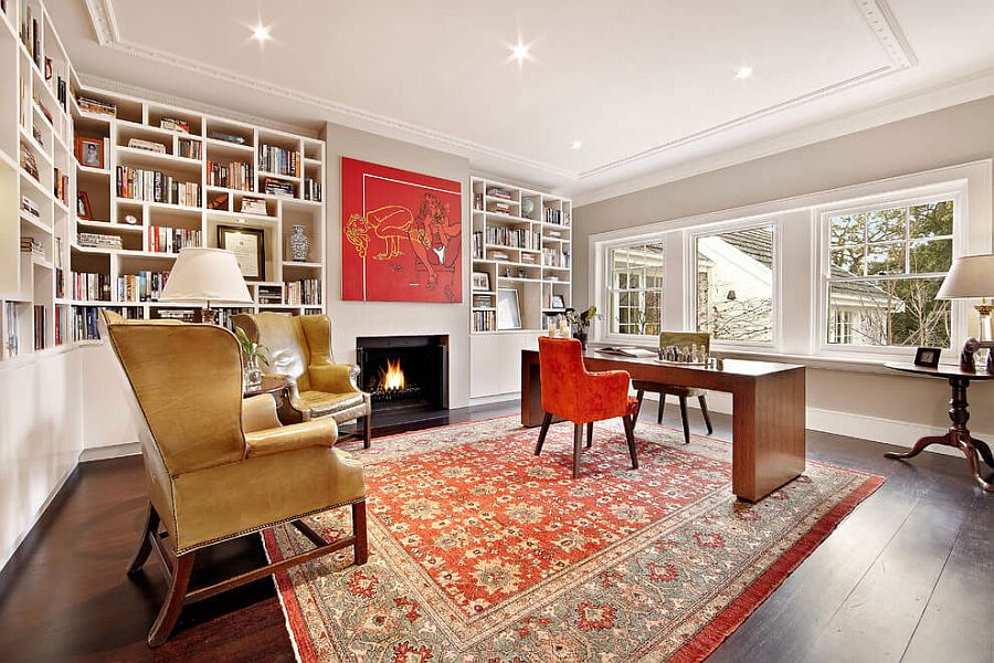 Home office and study with unique bookcase and pops of red