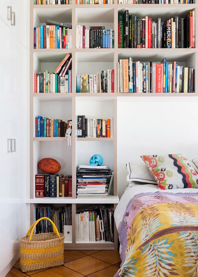 A Wall In This Bedroom Was Fully Built-In With Shelving, Headboard