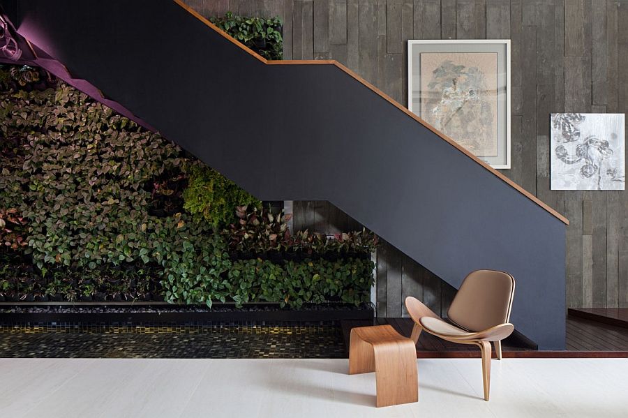 Indoor living wall and water feature adds greenery to the living space