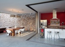 Kitchen-dining-and-entertaining-zone-of-the-house-with-a-stone-backdrop-217x155