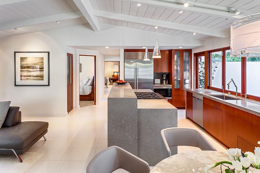 Kitchen with limetsone countertops and shelves in mahogany