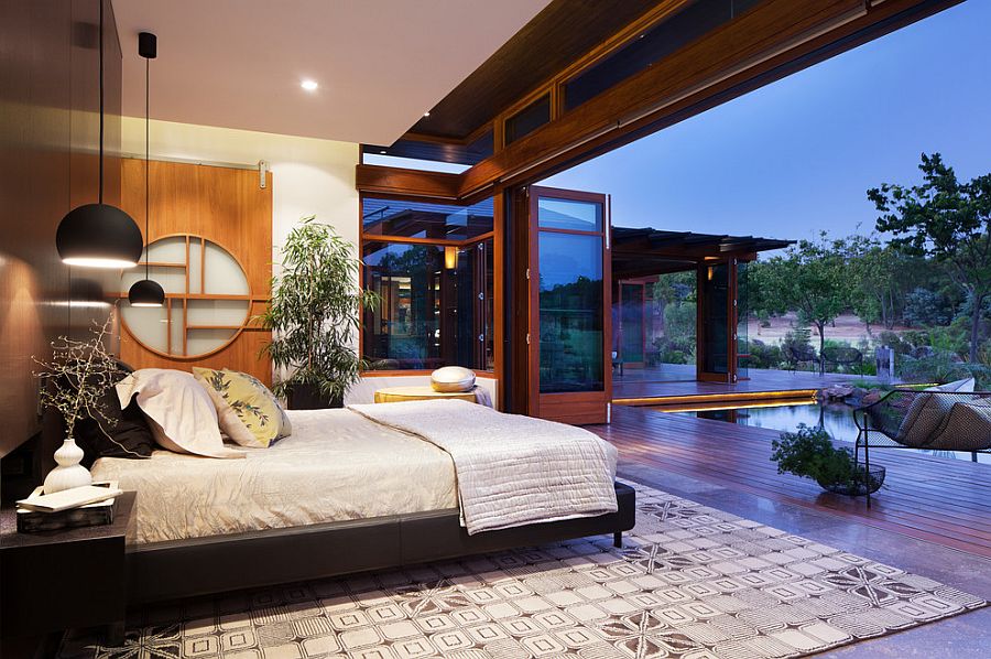 Landscape around the house becomes a part of the gorgeous Asian bedroom in Aussie home [Design: Suzanne Hunt Architect]