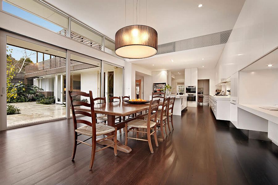 Large drum pendant above the dining table in wood