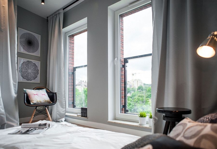 Large windows bring ample light into the small bedroom