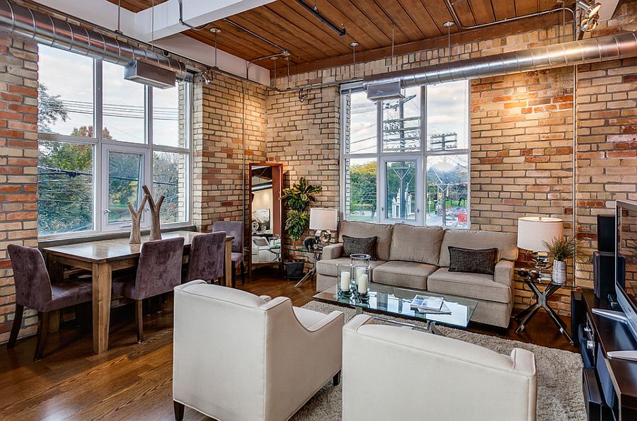 Living and dining room with exposed brick walls