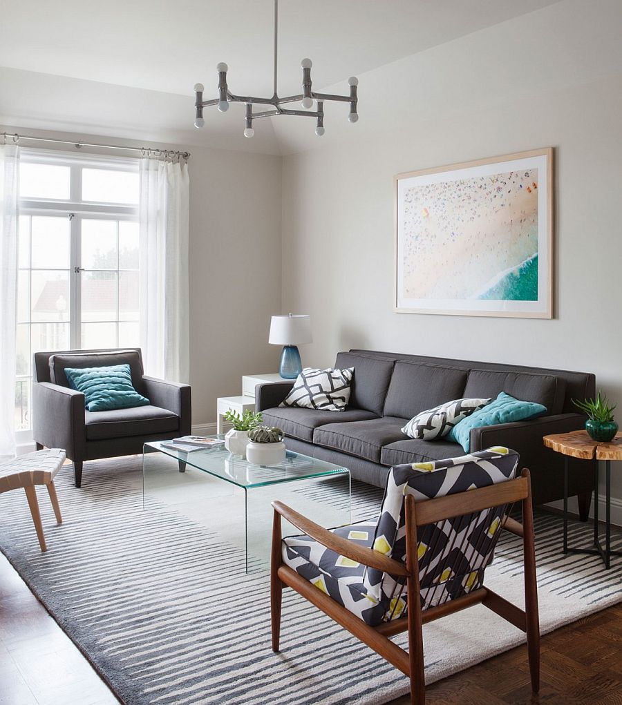 Living room of the contemporary Sna Francisco home with plush couch in gray and a variety of chairs