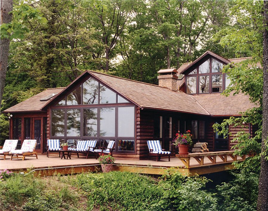 Log cabin deck embraces the natural landscape around it