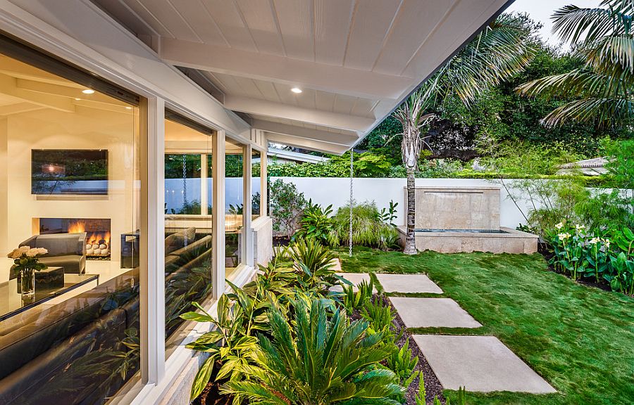 Low-pitched roof and exposed rafters of the revamped 50s style Californian home