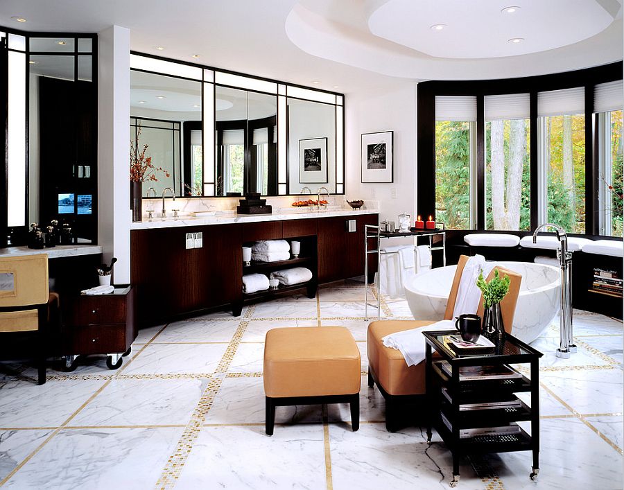 Luxurious bathroom goes the extra mile with a TV, lounge and a reading nook [Design: alene workman interior design]