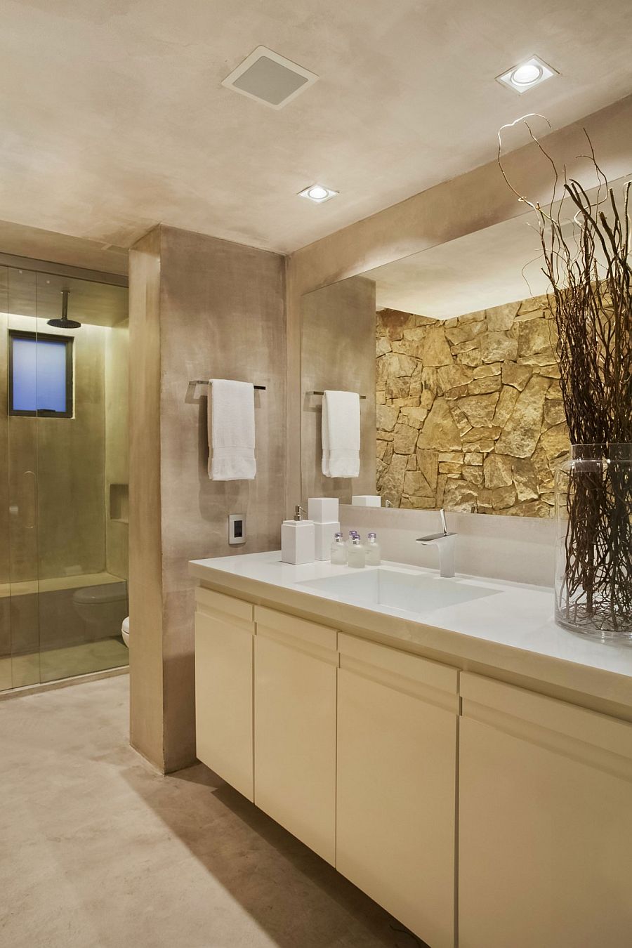 Master bath with stone and concrete walls