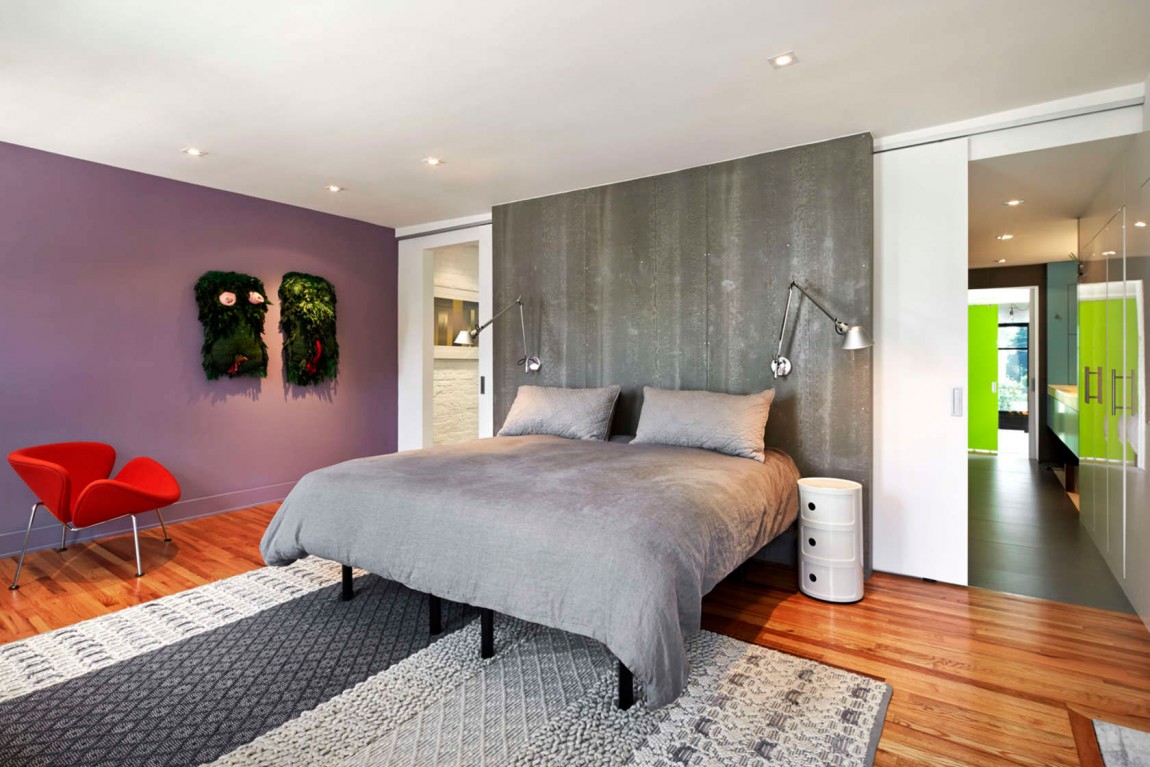 Master bedroom with concrete accent wall