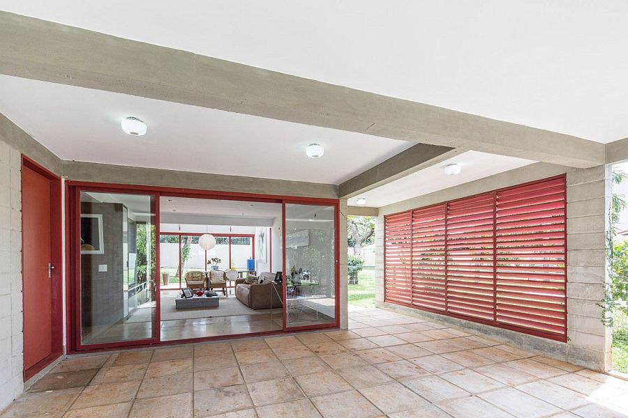 Metallic frame and windows in red add a punch of color to the interior