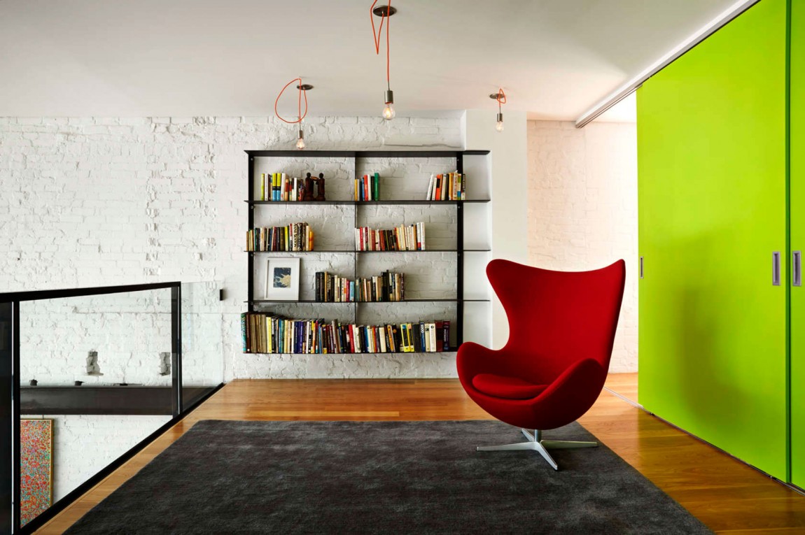 Mezzanine level with bookshelf and comfy Egg Chair