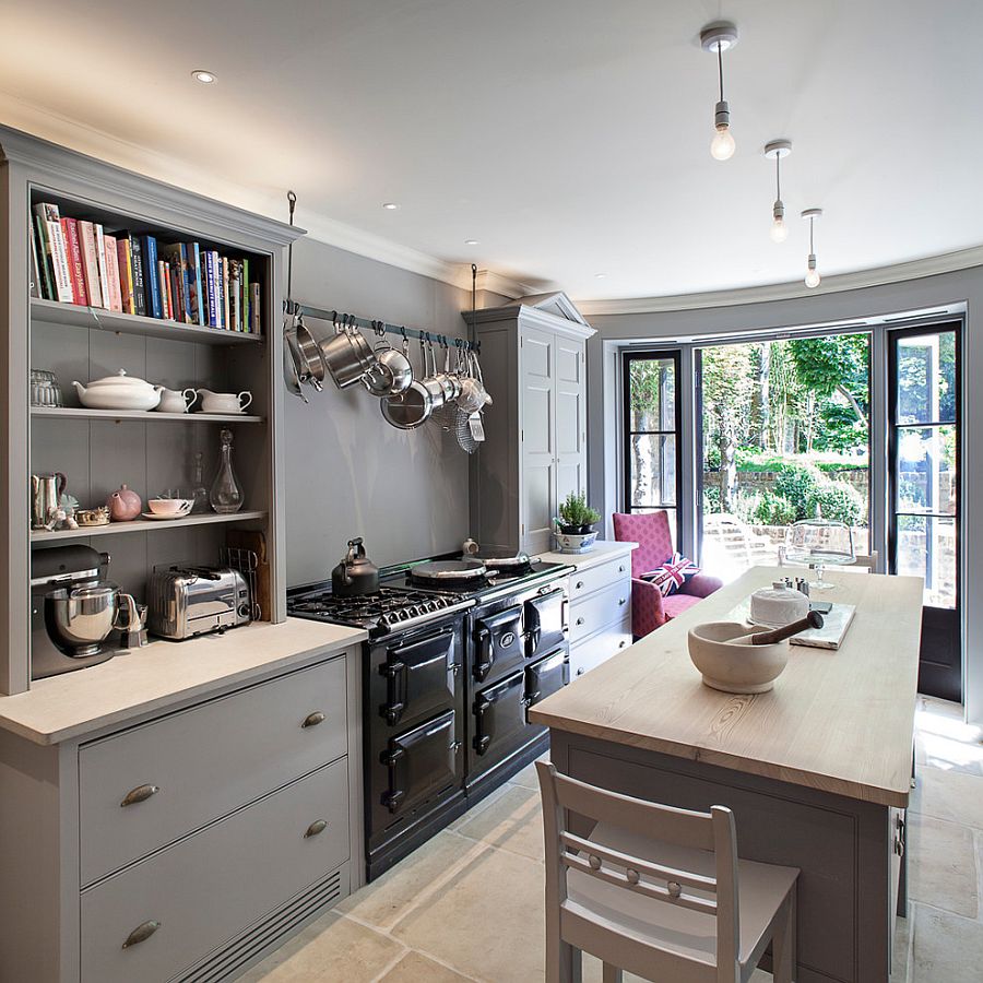 Mixed cabinet styles coupled with open gray shelves give the kitchen a modern appeal [Design: Russell Taylor Architects]