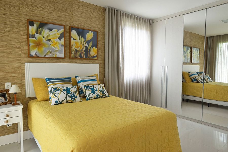 Modern bedroom with mustard yellow and blue accents