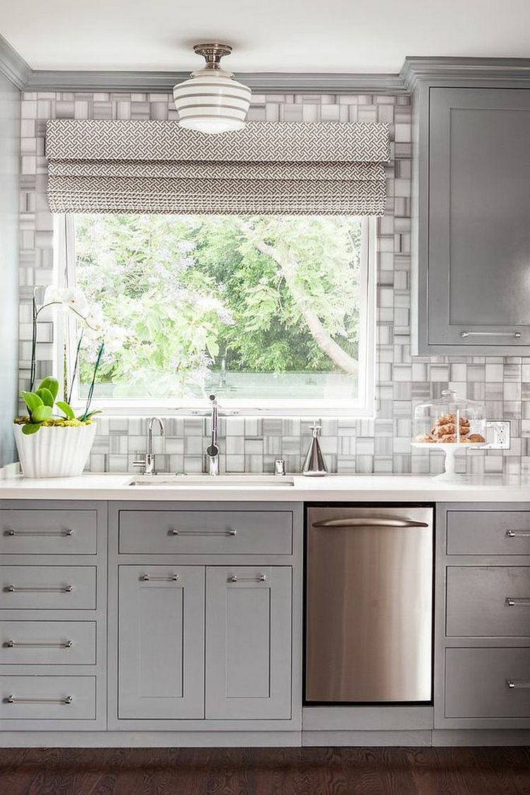 Modern classic kitchen in cool gray features a fabulous tiled backdrop [Design: Modern Nest]