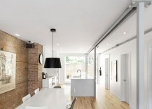 Natural-birch-flooring-and-exposed-brick-wall-give-the-interior-a-cozy-vibe-217x155