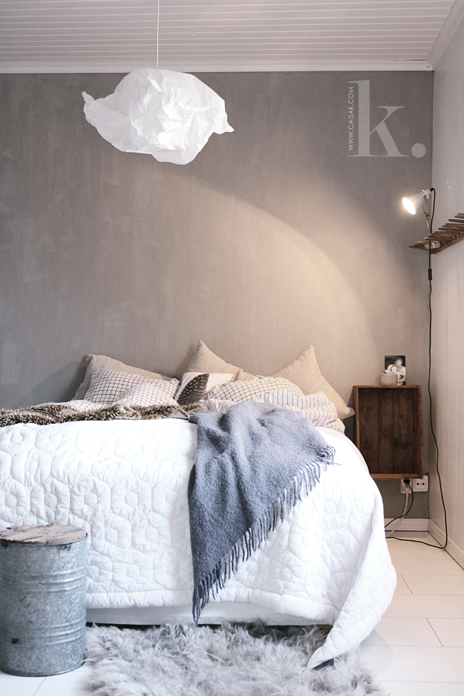 Neutral bedroom with cloud-like light fixture