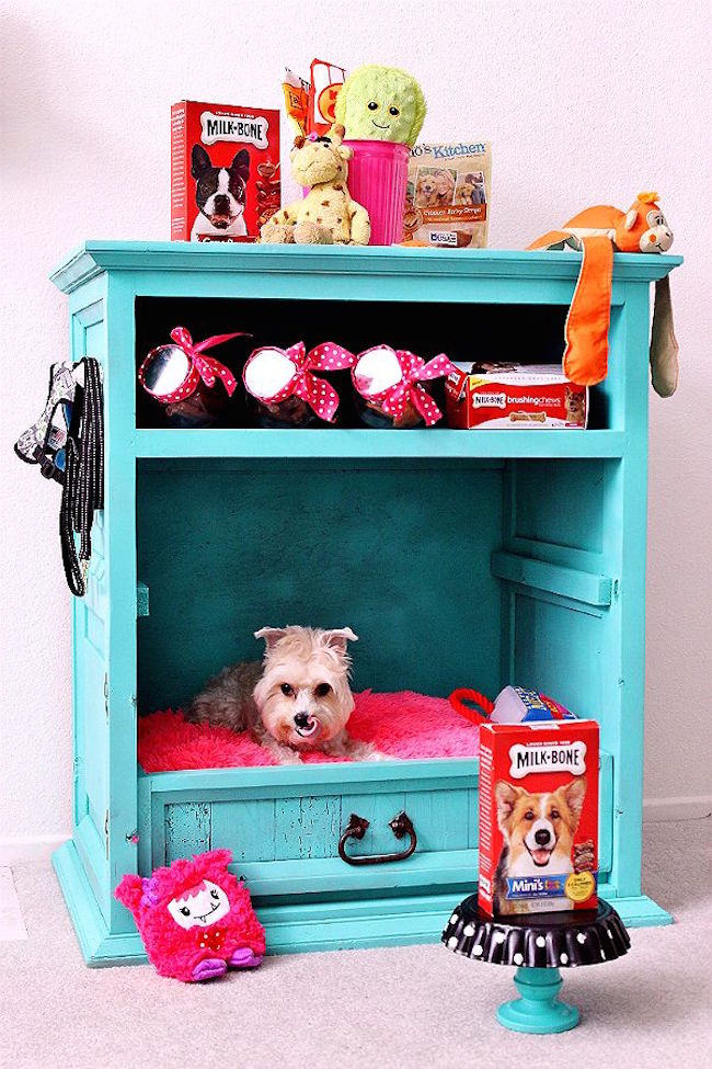 Old cabinet turned into a dog bed with storage space