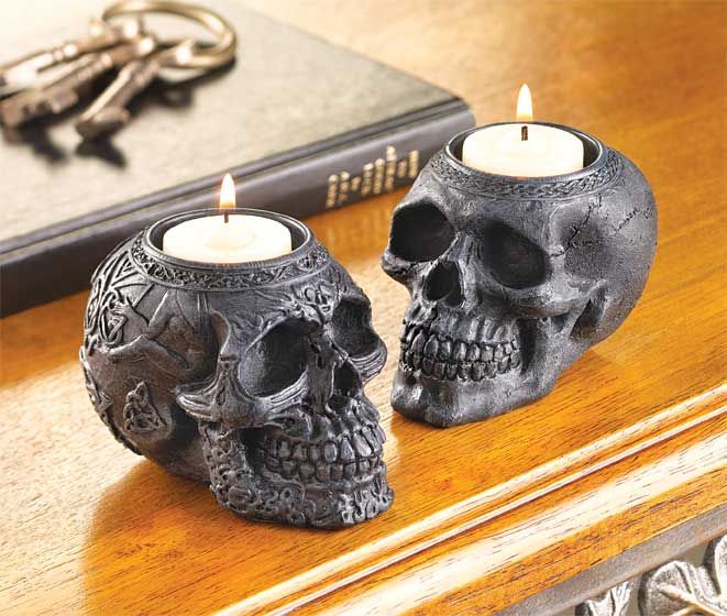 Ornate stone skull candle holders