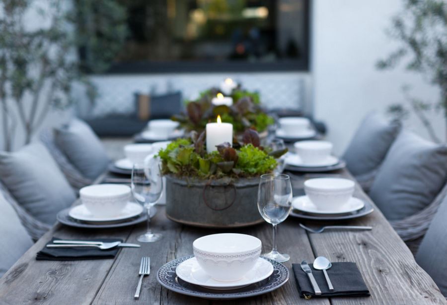 Outdoor dining table with candle centerpieces
