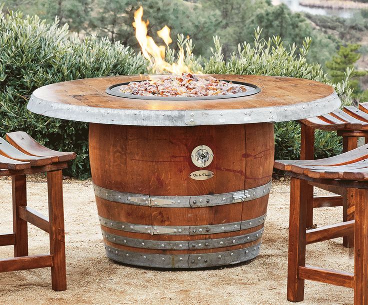 Outdoor fire pit made from an old wine barrel