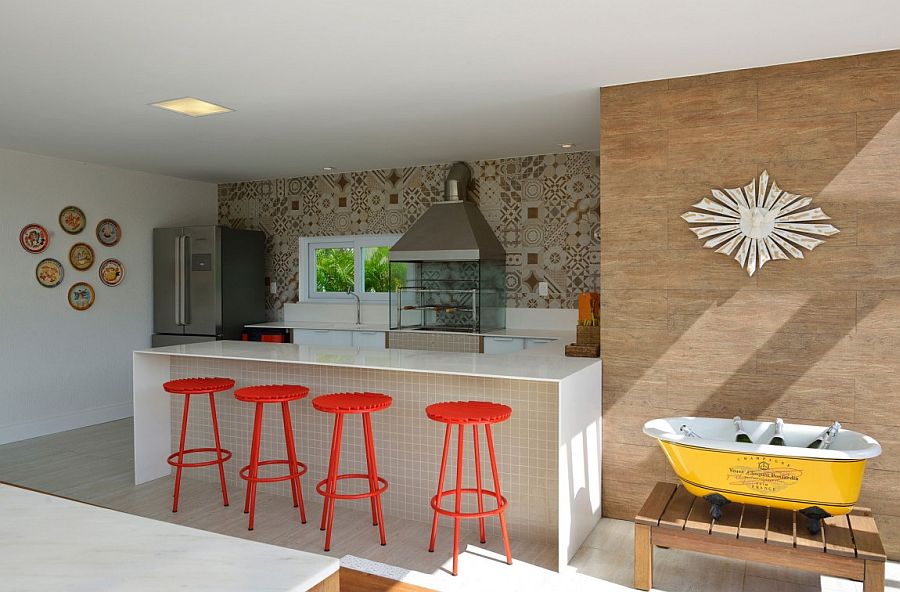 Outdoor kitchen and barbecue area with splashes of orange and yellow