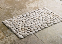 Pebble-bath-mat-with-light-colored-pebbles-217x155