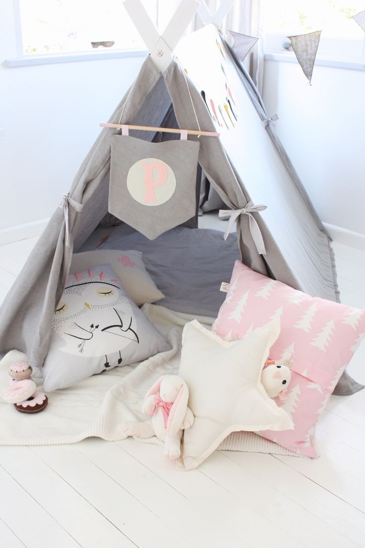 Pink, white, and gray teepee for a little girl's reading nook