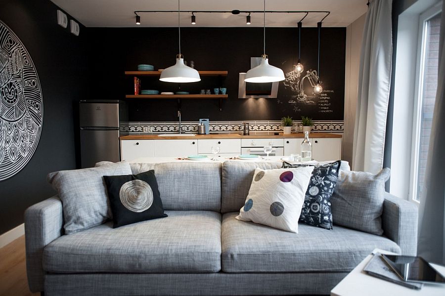 Plush gray couch in the living room with black walls