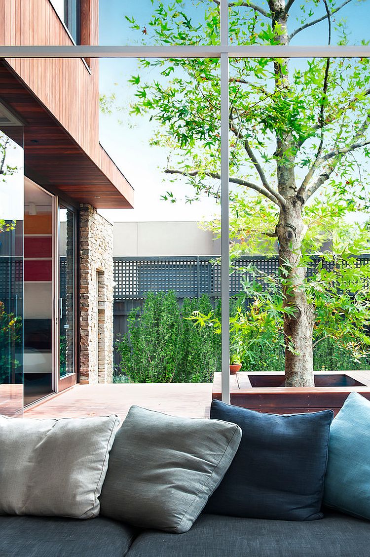 Plush seating indoors with a view of the deck and the pool area