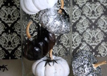 Pumpkins-painted-black-and-white-in-glass-cylinder-217x155