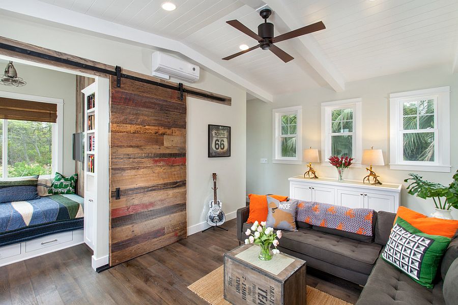 Reading nook and cozy window seat hidden behind the barn door