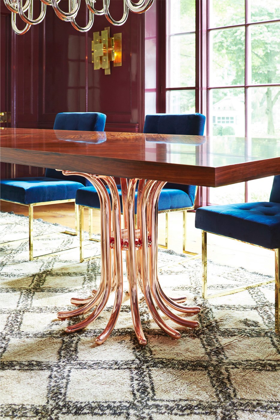 Rosewood table with a rose gold base from Jonathan Adler