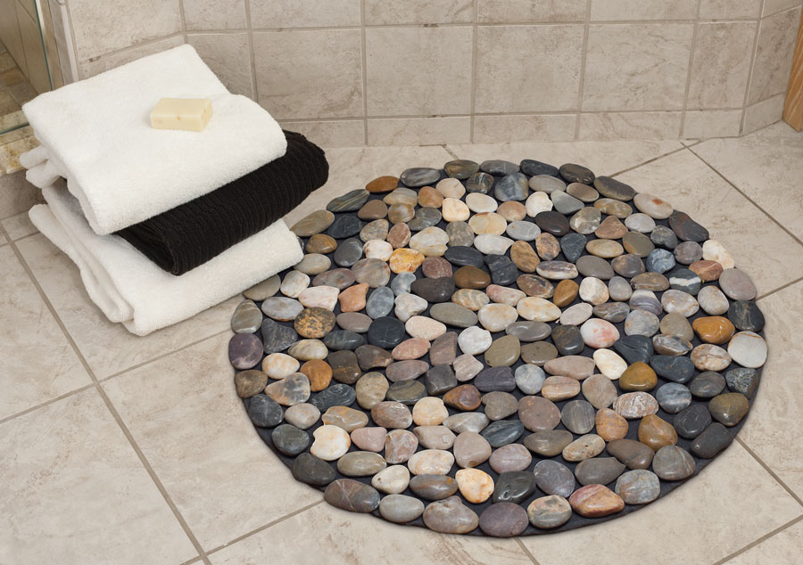 Round bath mat with different colored pebbles