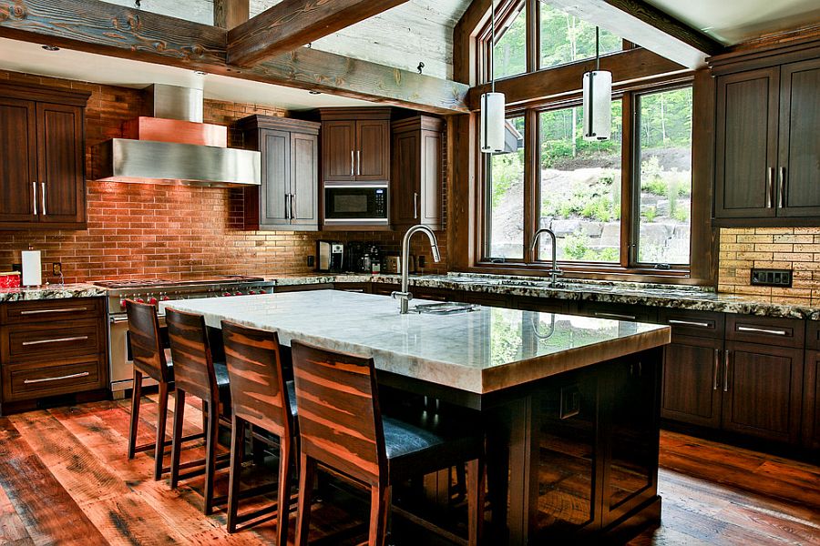 Rustic kitchen combines exposed brick and stone walls with weatherd wooden beams