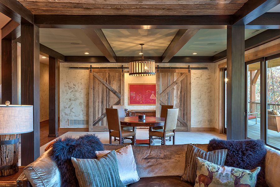 Rustic living room with sliding barn doors [Design: Glennwood Custom Builders]