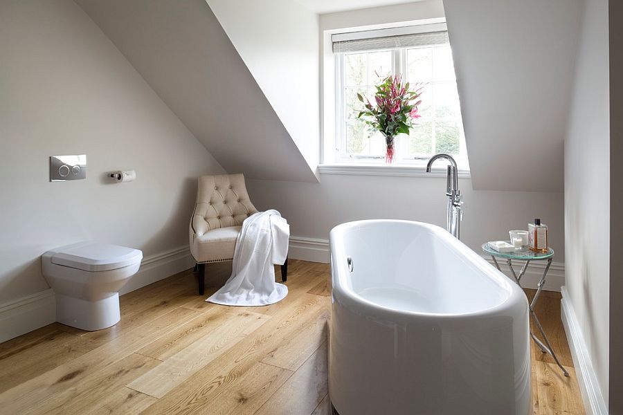 Simple side table with glass top next to the white standalone bathtub [Design: James Hargreaves Bathrooms]