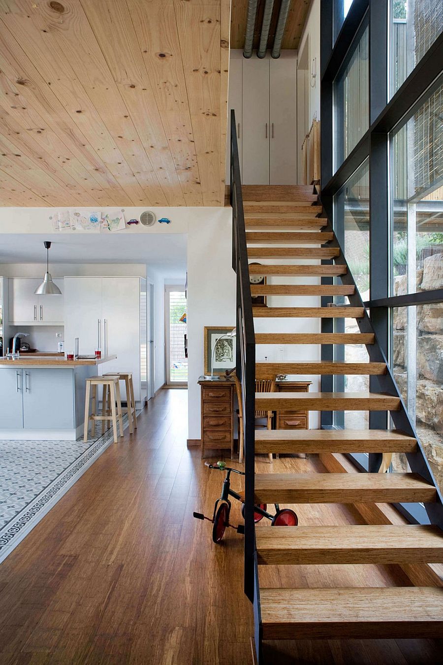 Simple staircase connects the lower level with the bedrooms above