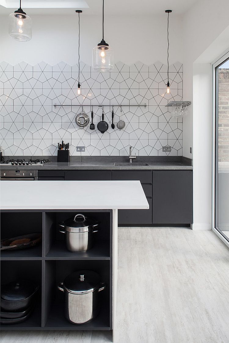 Simplicity of lighting and pattern of the backsplash hold your attention in this Scandinavian kitchen