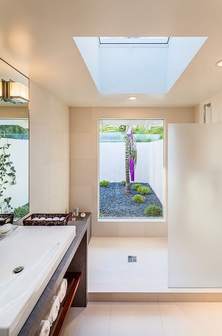 Skylight adds to the flood of natural light inside the breezy bathroom