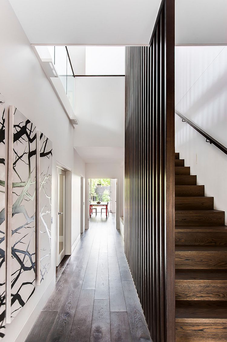 Sleek entry of the Melbourne home with gallery style walls