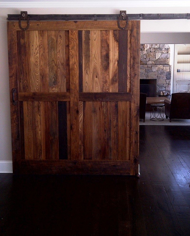 Sliding barn doors made from reclaimed chestnut lumber for living space