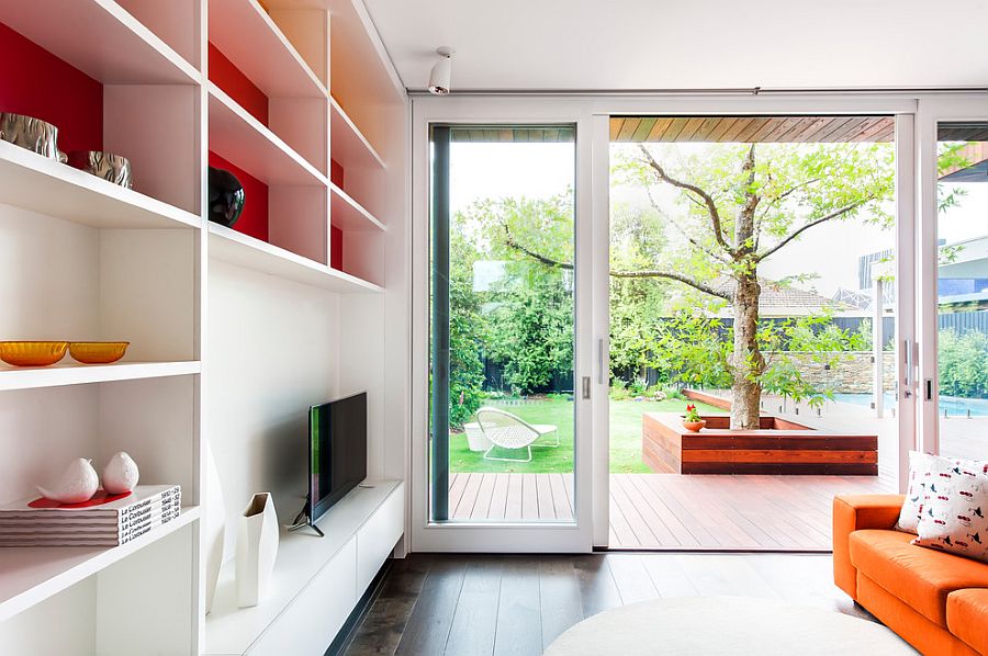 Sliding glass doors connect the kids' room with the lavish deck outside