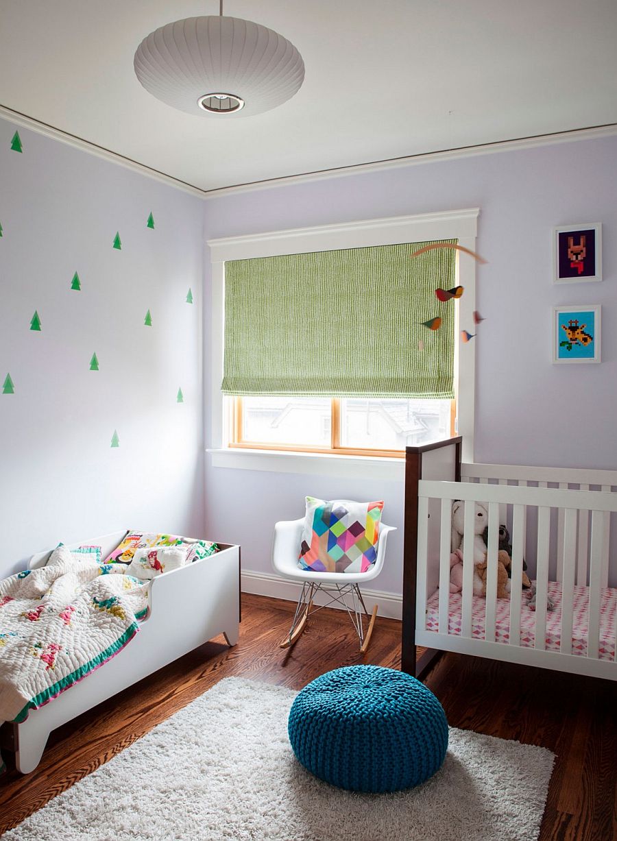 Small nursery design with baby bed and a crib