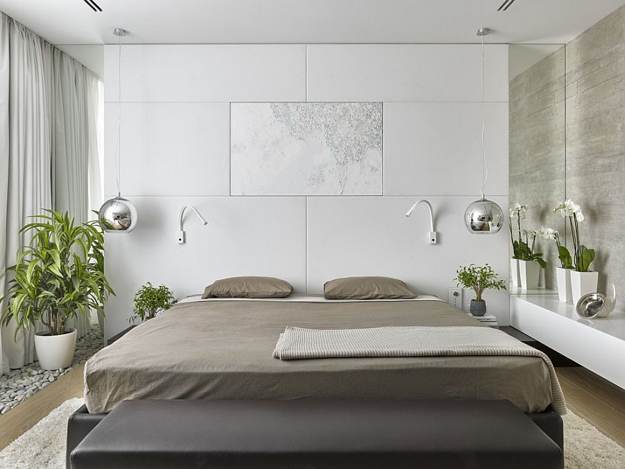 Soft white leather headboard wall, bedside pendants and greenery fashion a rejuvenating bedroom [Design: Alexandra Fedorova Office]