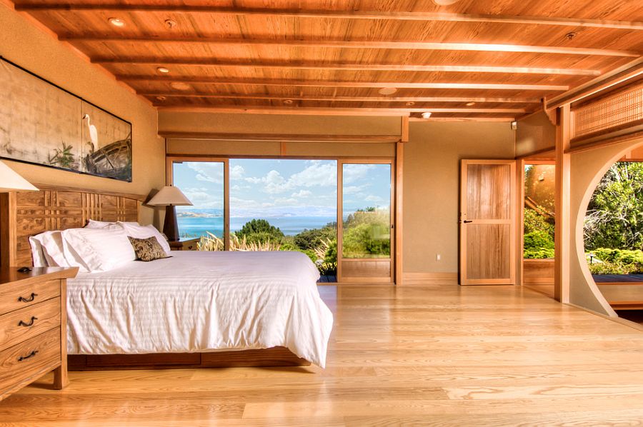 Soothing wooden tones and natural materials give the bedroom with a view a tranquil touch