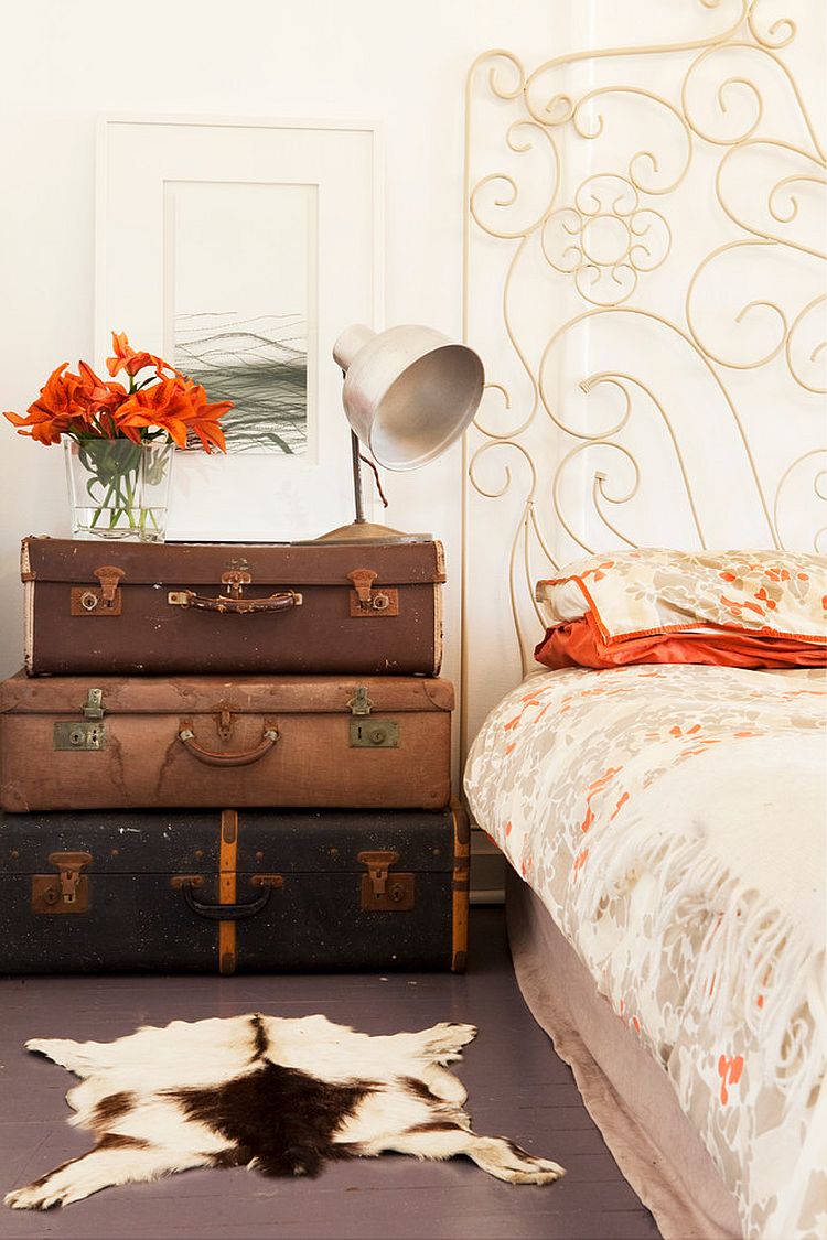 Stacked vintage suitcases serve both as bedside table and storage [Design: Twinkle and Whistle]