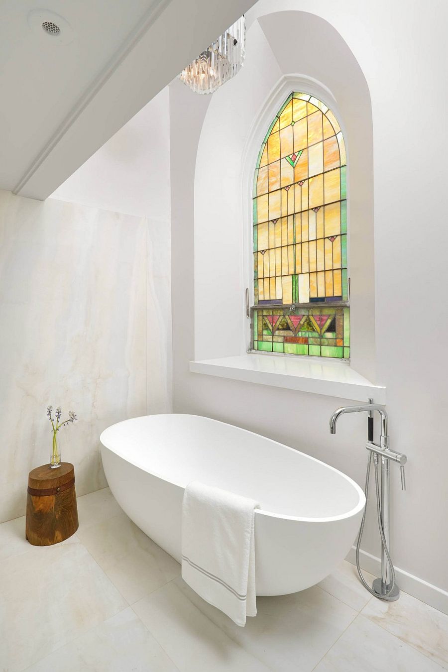 Stained glass window makes its presence felt in the contemporary bathroom