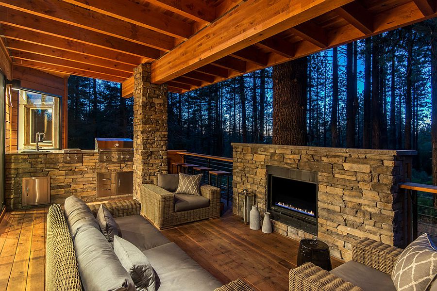 Stone and wood outdoor deck with barbecue zone and fireplace